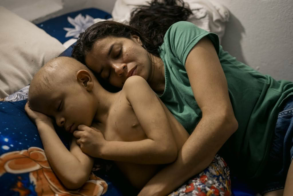 Woman carrying a smiling child