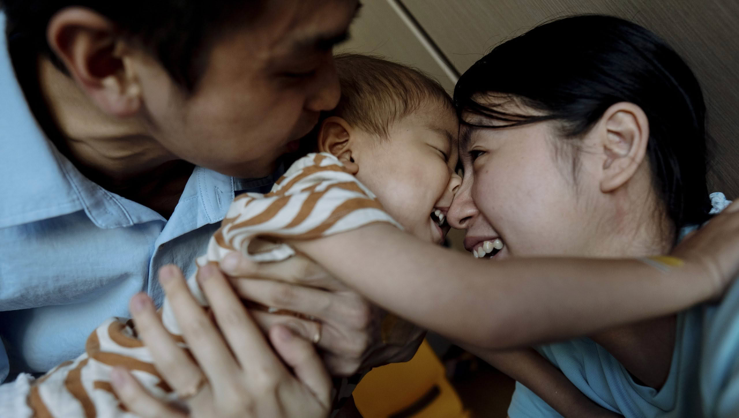 Woman carrying a smiling child