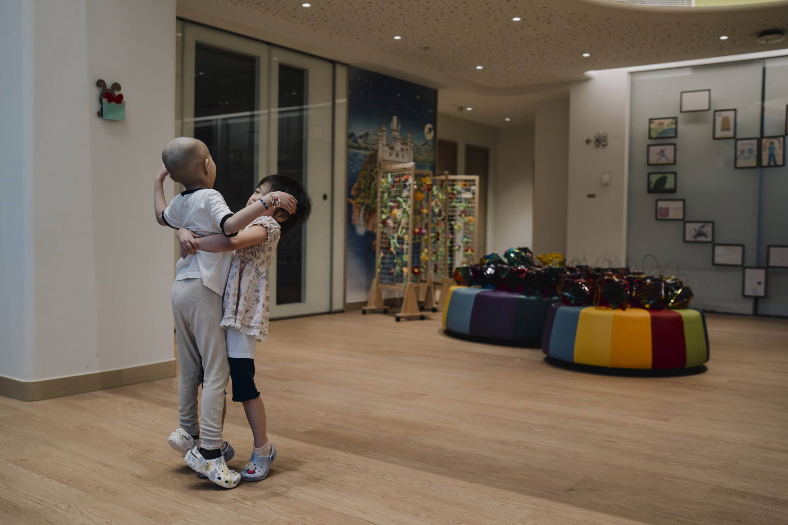 Woman embracing a young child in care