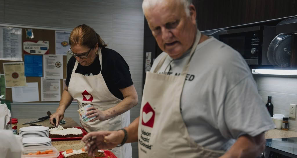 Volunteers cooking in the kitchen