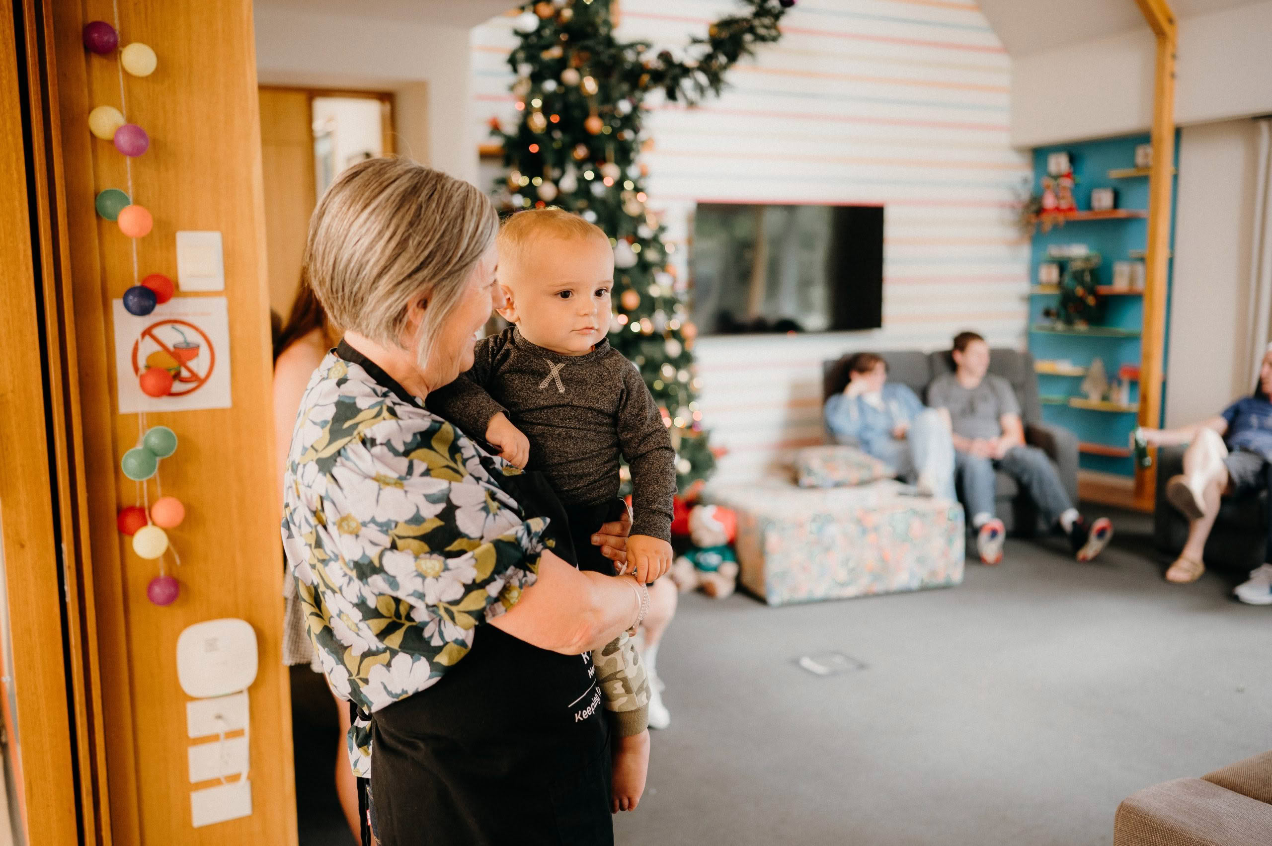 Woman carrying baby Christmas