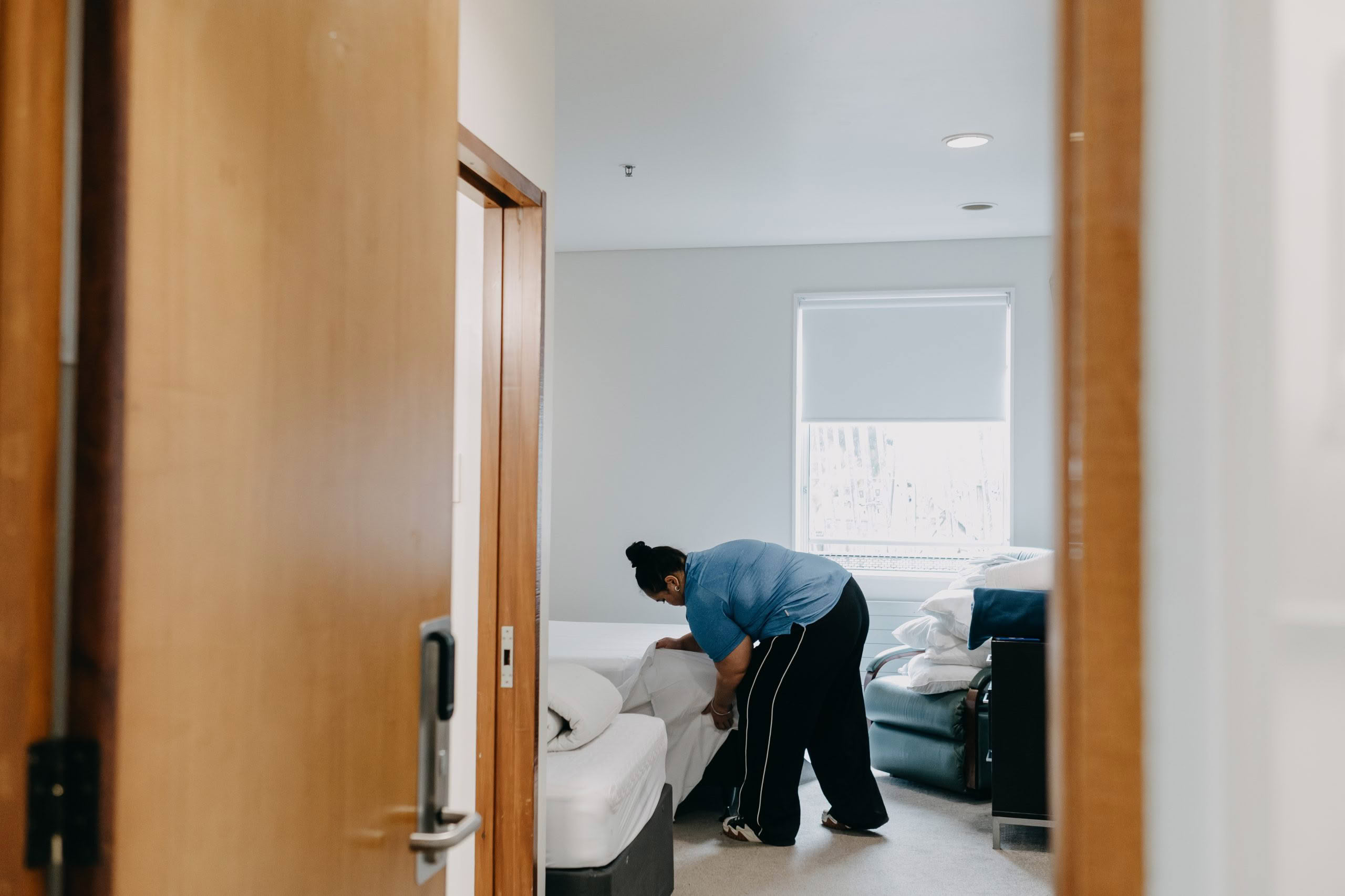 Volunteer making bed