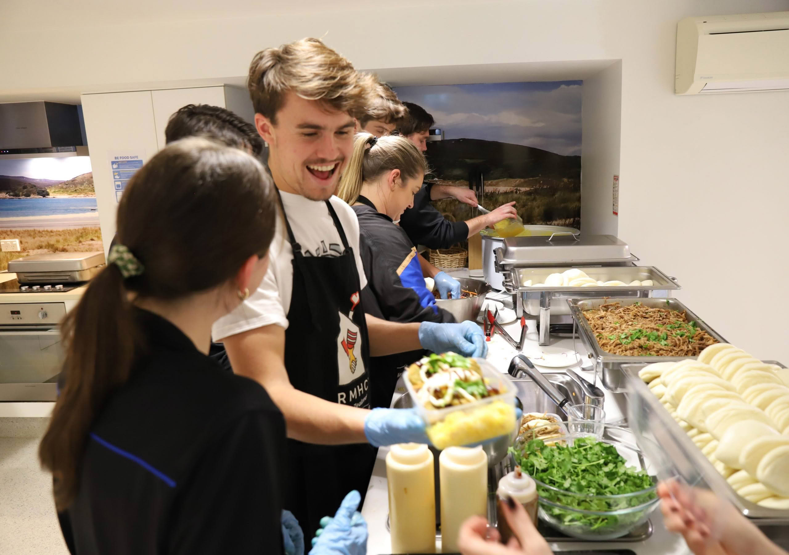 Volunteers preparing food in Auckland House